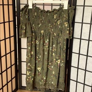 Cute green off the shoulder dress.